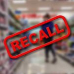 Injury Reports Trigger Massive Food Recall Recall stamp on blurred store aisle background