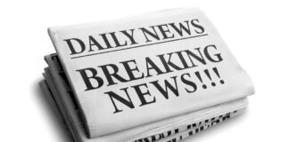 Stack of newspapers with breaking news headline