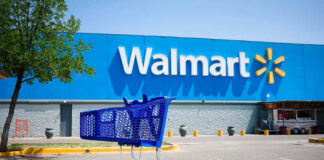 Shopping cart in a Walmart parking lot.