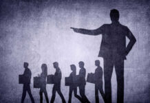 Jobs GONE — Biggest Layoff in Years Shadows of laid-off workers walking, large figure pointing.