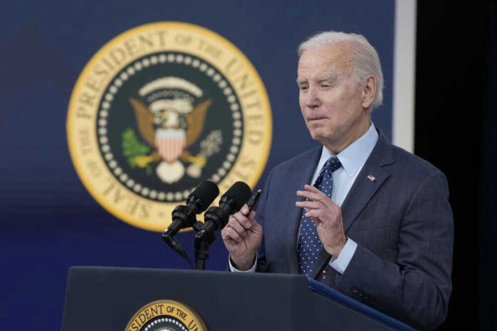 shutterstock_2266516955.jpg President Biden speaking at a podium
