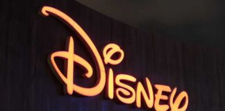 Illuminated Disney logo against a dark background