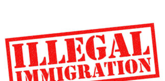 Red illegal immigration stamp on white background