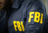 FBI agent in navy blue jacket