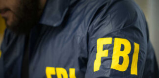 FBI agent in navy blue jacket
