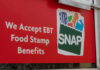 Red sign showing SNAP EBT food stamp benefits