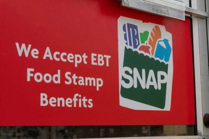 shutterstock_1757584442.jpg Red sign showing SNAP EBT food stamp benefits