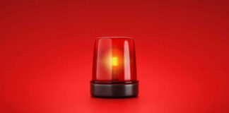 Red emergency light on red background