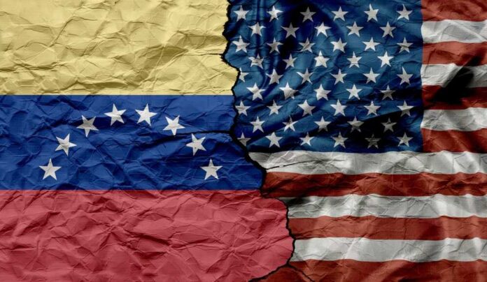 Crumpled flags of Venezuela and the United States split in the center