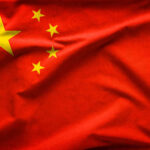 Communist China CRUSHES 78-Year-Old Democracy Hero Red flag with five yellow stars, Chinas flag.