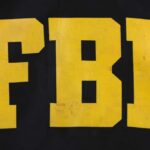 FBI logo displayed in large yellow letters on a black background