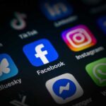 Allies SHOCKED: America Demands Social Media Surrender Close-up of various social media application icons on a smartphone screen