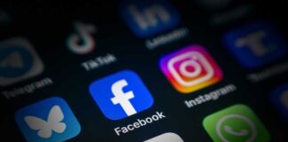 Close-up of various social media application icons on a smartphone screen