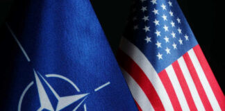 NATO flag and United States flag side by side.