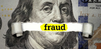 Dollar bill with fraud text overlay