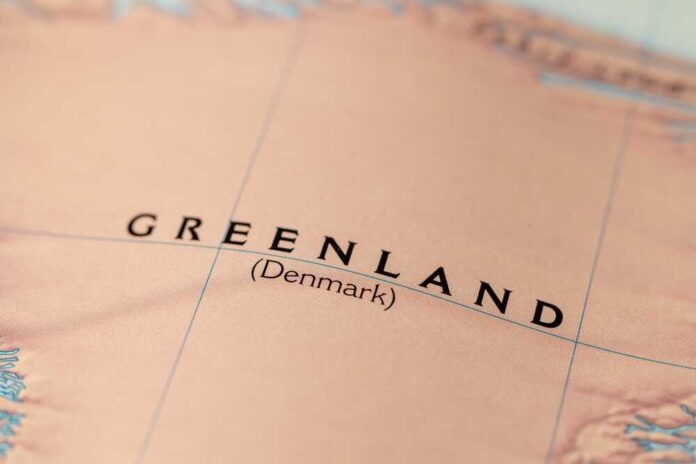 shutterstock_2433673231.jpg Close-up of a map showing Greenland labeled as Denmark