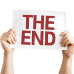 Trump Ends Protections for 600,000 Venezuelans Hands holding a sign that reads 'THE END'