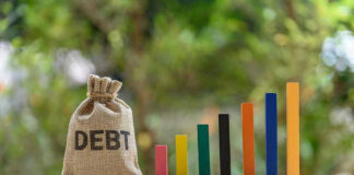 Debt sack with rising financial graph bars.