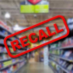 RECALL: 174K Gas Ranges Pose Danger Blurred store aisle with RECALL stamp overlay.