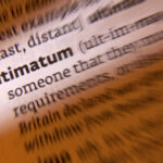 Trump’s Ultimatum Stuns Senate Close-up of a dictionary page showing the definition of 'ultimatum'