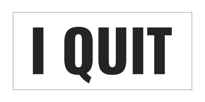 A bold text sign that reads 'I QUIT'