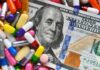 A hundred dollar bill surrounded by various colorful capsules and pills