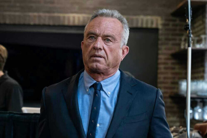 shutterstock_2456684687.jpg Robert F Kennedy JR in suit indoors.