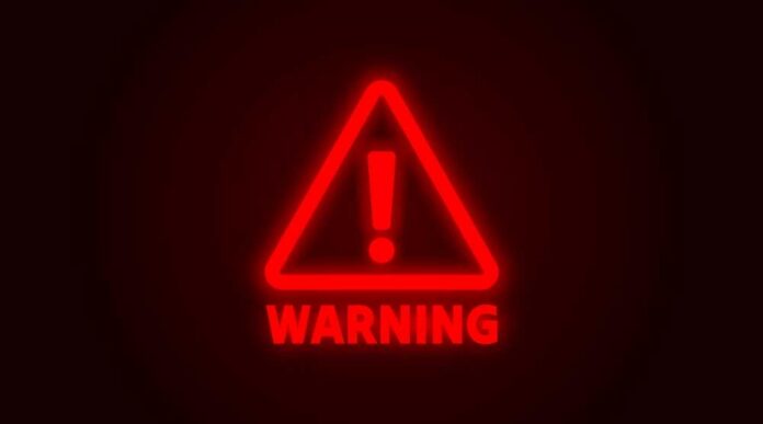 shutterstock_2575029833.jpg Red neon warning sign with an exclamation mark