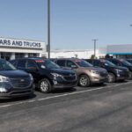 New Truck Alliance Targets Hard-Working Americans Row of used cars for sale at a dealership with price tags displayed