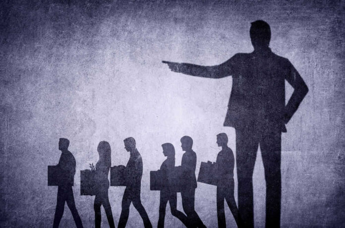 shutterstock_2254036017 Shadows of laid-off workers walking, large figure pointing.