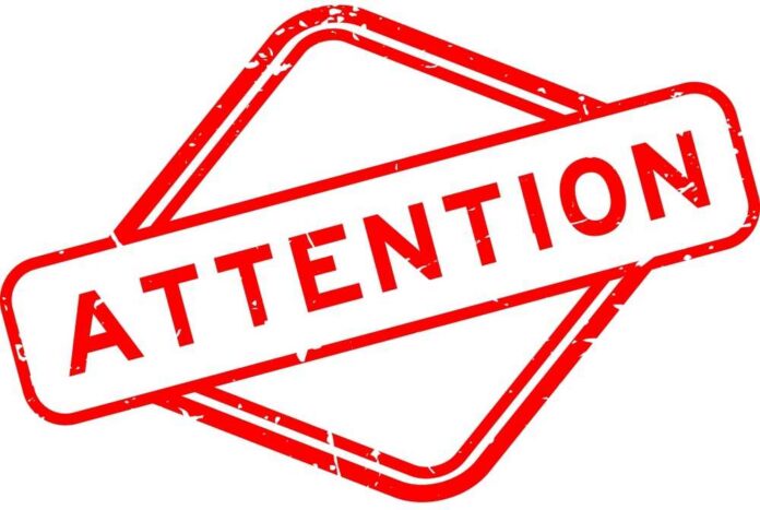 shutterstock_2292033991.jpg Red attention sign with the word 'ATTENTION' in bold letters