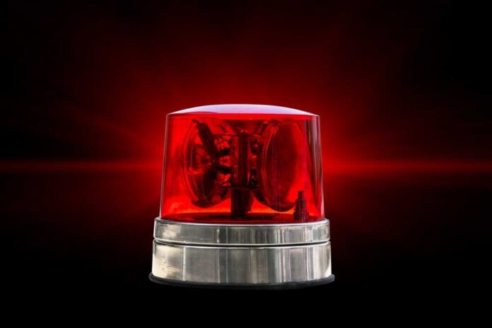 Red emergency light on a black background