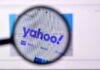 Yahoo! Search Vanishes—End Of An Era Magnifying glass focusing on the Yahoo website logo