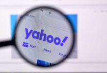 Magnifying glass focusing on the Yahoo website logo