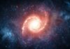 A vibrant galaxy surrounded by stars and cosmic clouds