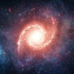 Tiny Icy World Teases “Air” A vibrant galaxy surrounded by stars and cosmic clouds