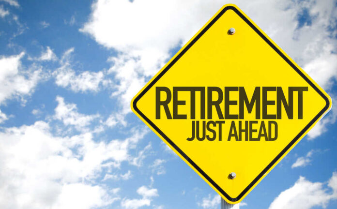 shutterstock_319833791.jpg A yellow road sign indicating retirement is just ahead