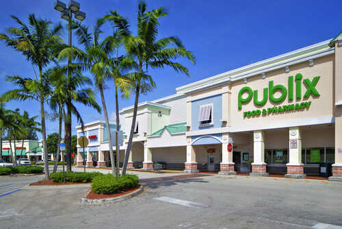 Exterior view of a Publix grocery store with palm trees