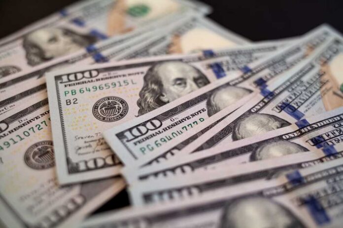 Close-up of scattered hundred dollar bills
