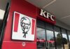 KFC restaurant sign against a blue sky