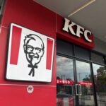 KFC restaurant sign against a blue sky