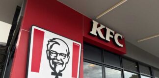 KFC restaurant sign against a blue sky