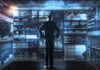 A businessman analyzing data on a digital interface